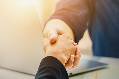 Close up of business people shaking hands